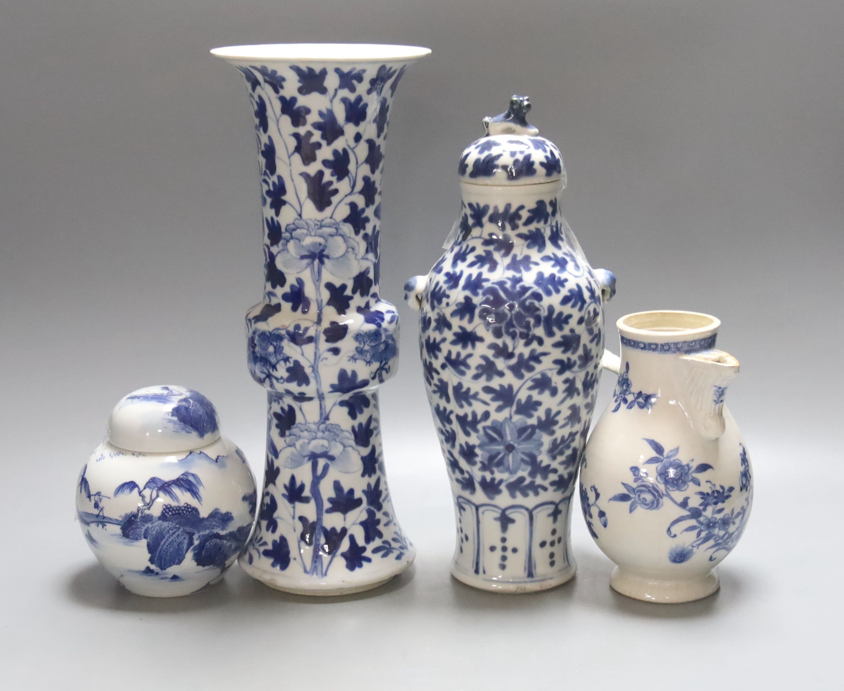 Two 19th century Chinese blue and white vases, an 18th Century blue and white jug and a later jar and cover, tallest 30cm